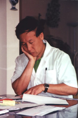 Mr. Gao studying a Chinese Medical text
